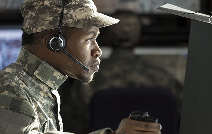 soldier with headset at computer
